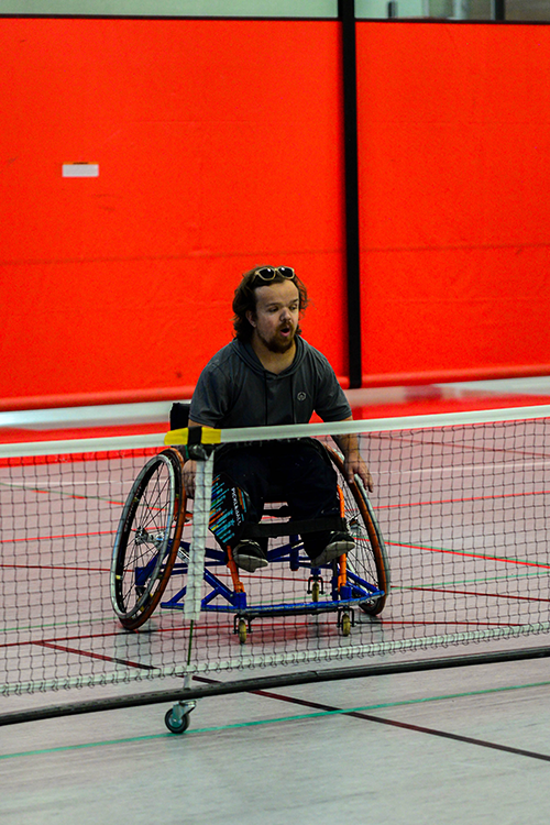 Male playing wheelchair pickleball